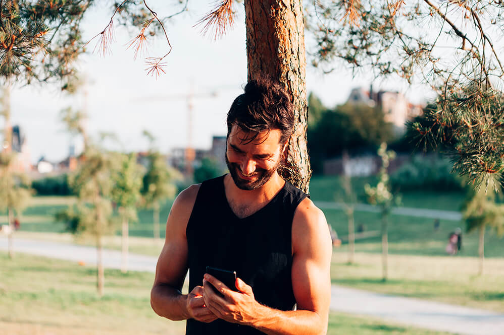 smiling-attractive-sporty-man-in-tank-top-leaning-2025-02-12-03-56-48-utc (1)