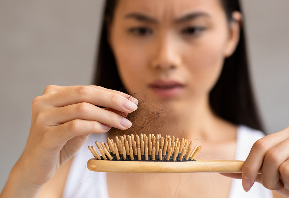 upset-millennial-asian-woman-holding-hairbrush-cl-2025-03-18-17-28-41-utc (1)