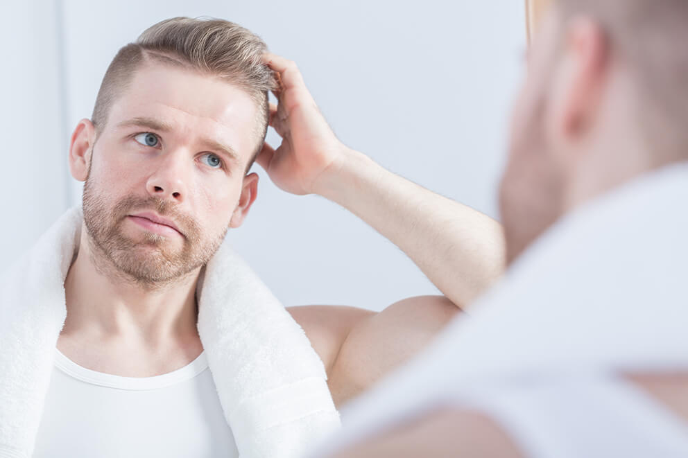 young-handsome-guy-looking-at-the-mirror-2025-10-09-20-32-03-utc (1)