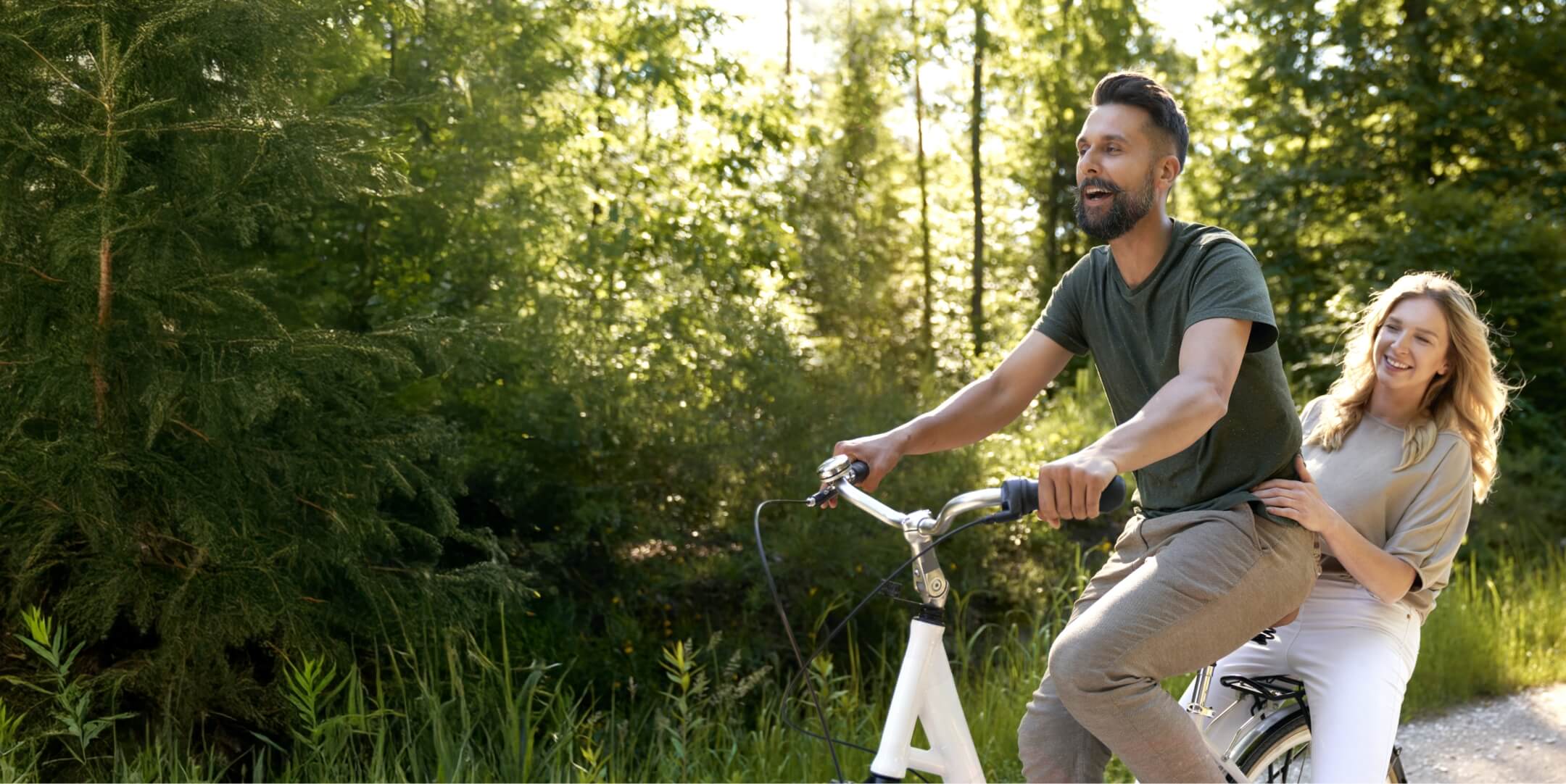 playful-couple-having-fun-on-a-bike-in-the-woods-2024-12-03-21-42-41-utc